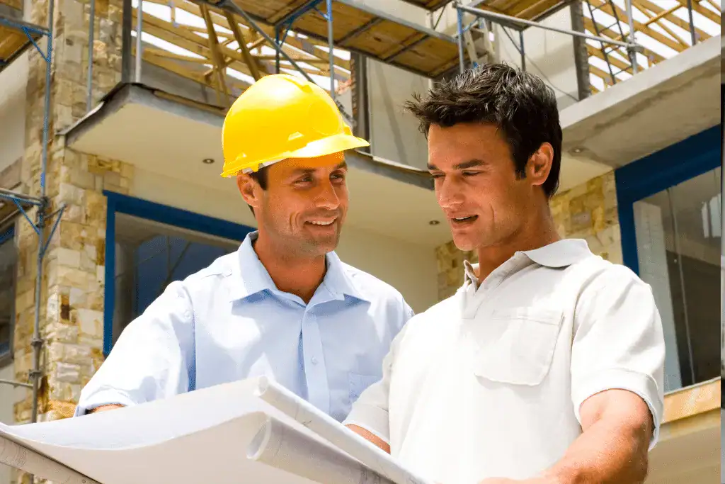 Roofing contractor discussing warranty options with a Toronto homeowner during a consultation.