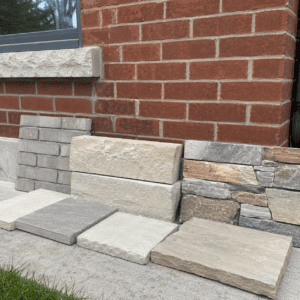 Brick and stone colour samples compared beside a Toronto red brick wall