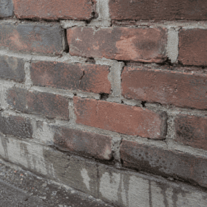 Damaged brick and mortar that should be repaired before sealing
