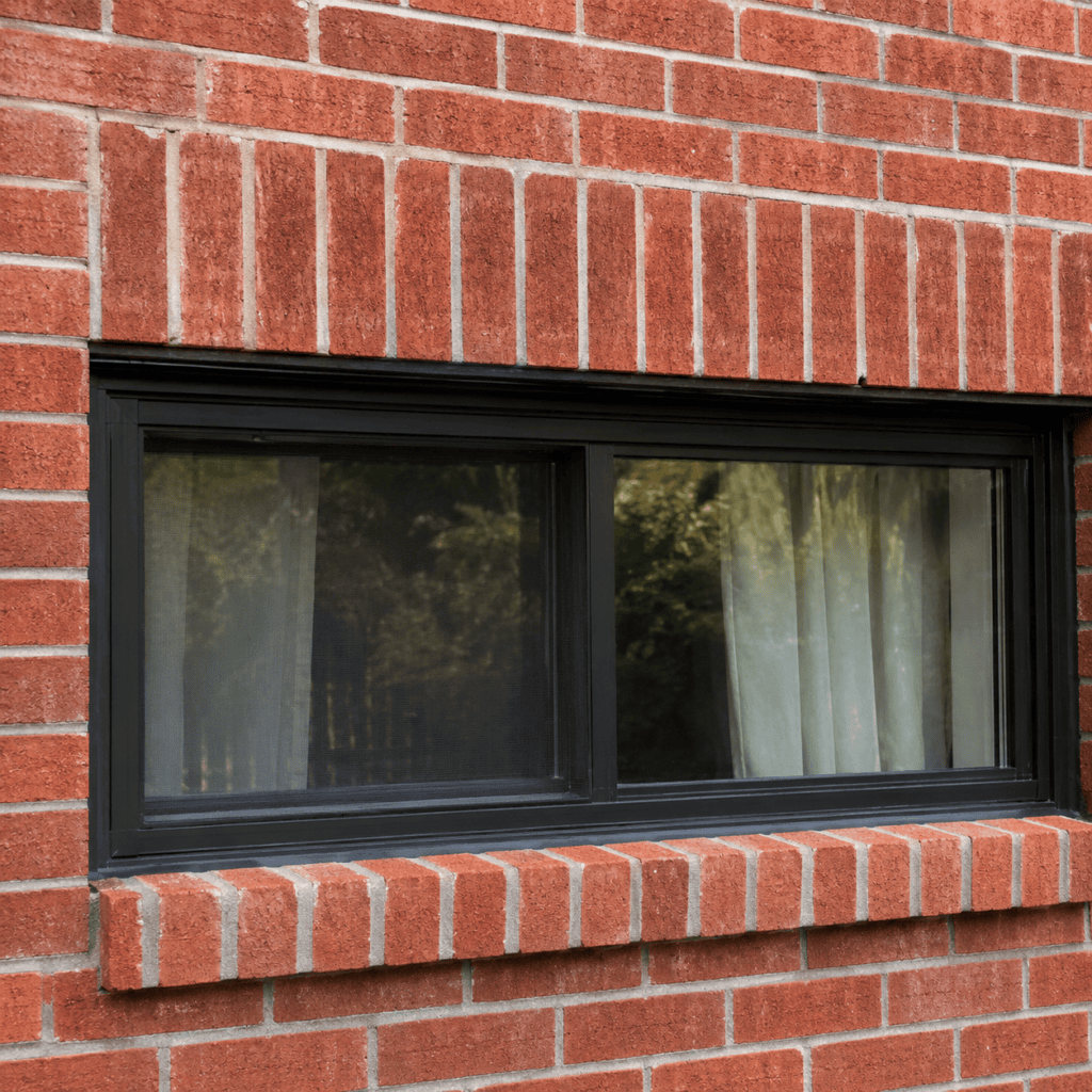 Soldier course and rowlock brick details around a Toronto home window
