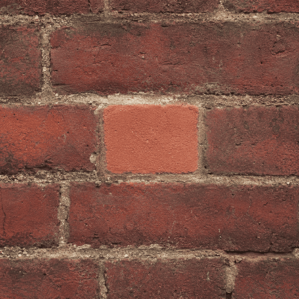 Small test cleaning area on historic brick before full cleaning