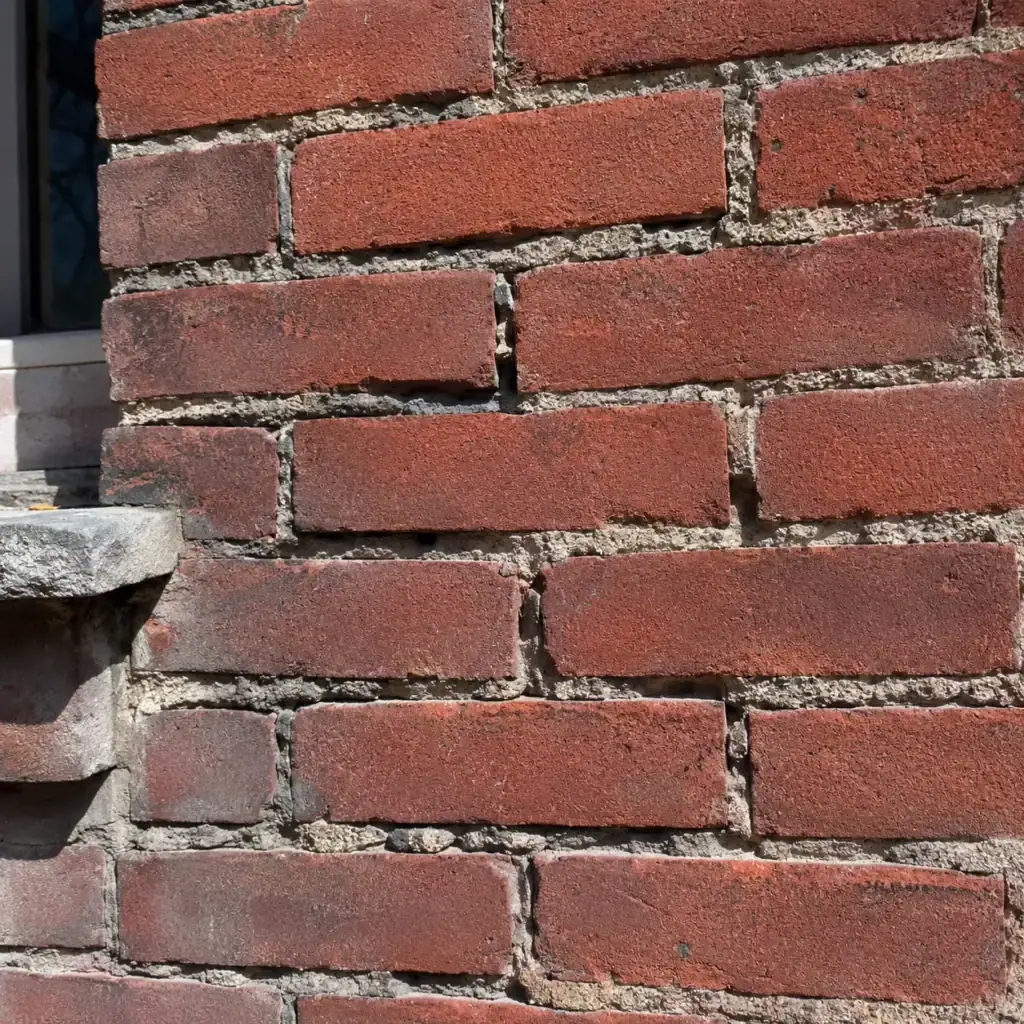 Sound bricks with deteriorated mortar joints requiring repointing