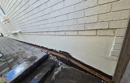 After Exterior Foundation Parging Repair Beside Front Porch