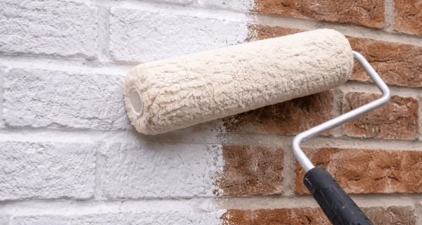 White paint on red brick wall