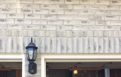After Garage Door Brick Wall Repair Above Entrance​