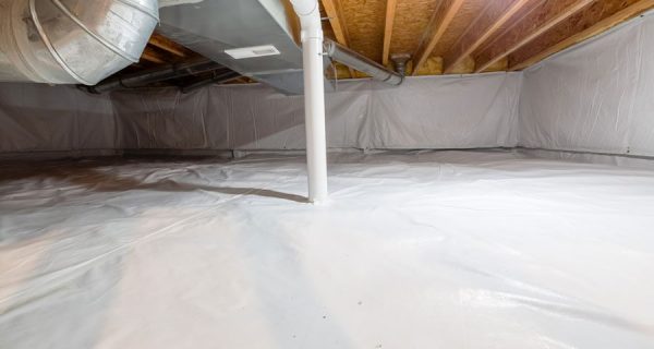 Encapsulated crawl space with white vapor barrier covering the floor and foundation walls