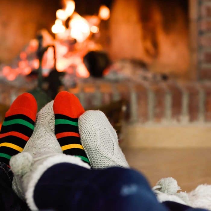 feet-christmas-socks-near-fireplace.jpg