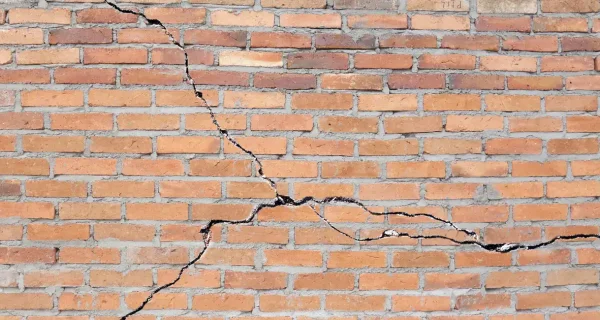 Cracked brick wall caused by frost damage in Toronto